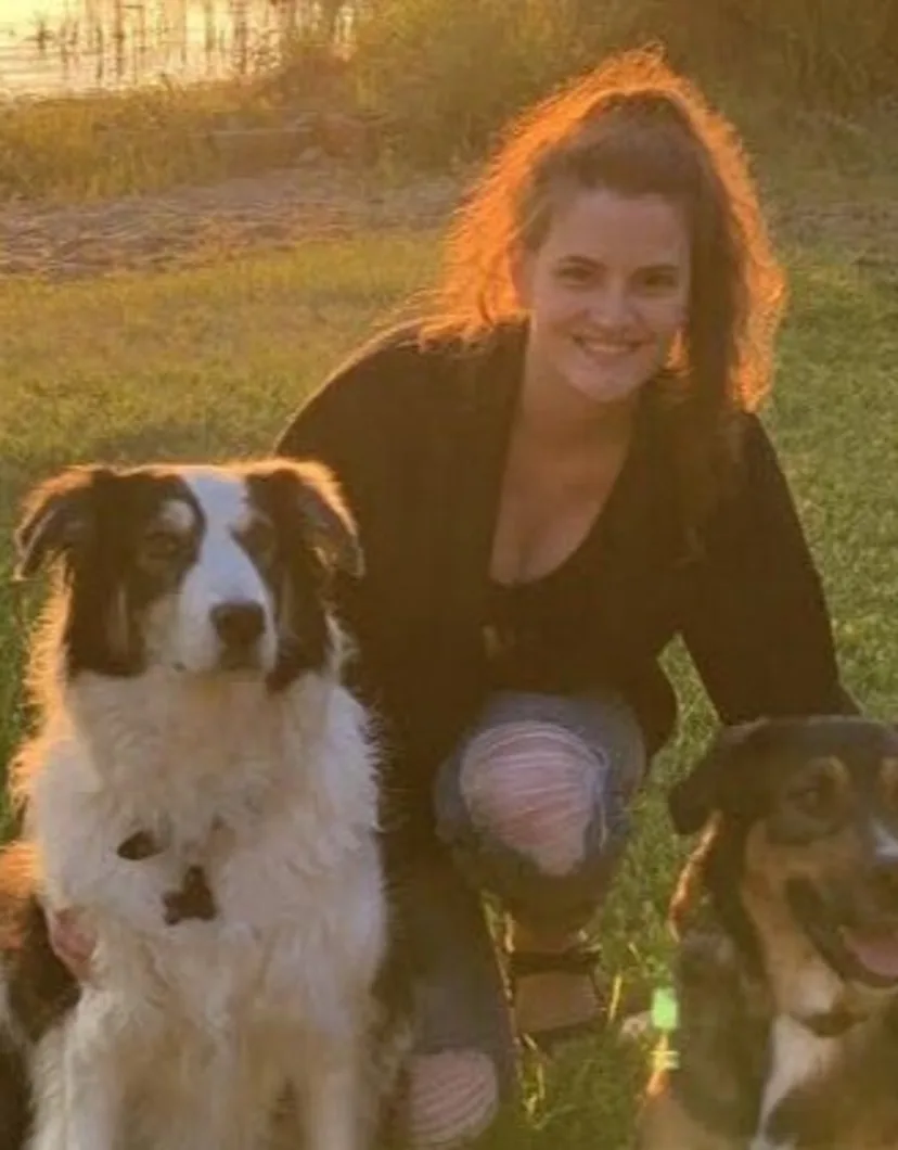 Laura with two dogs